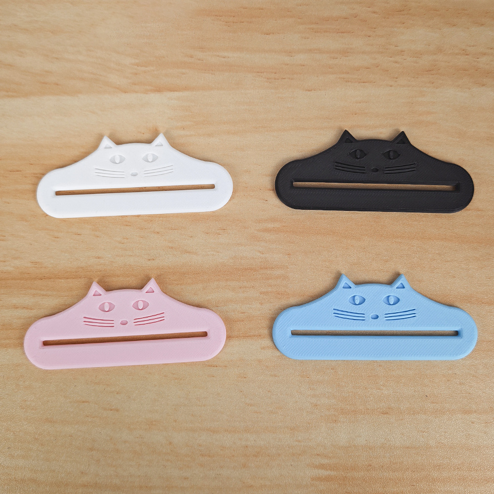 3D-printed gadget: cat treat/paste squeezer