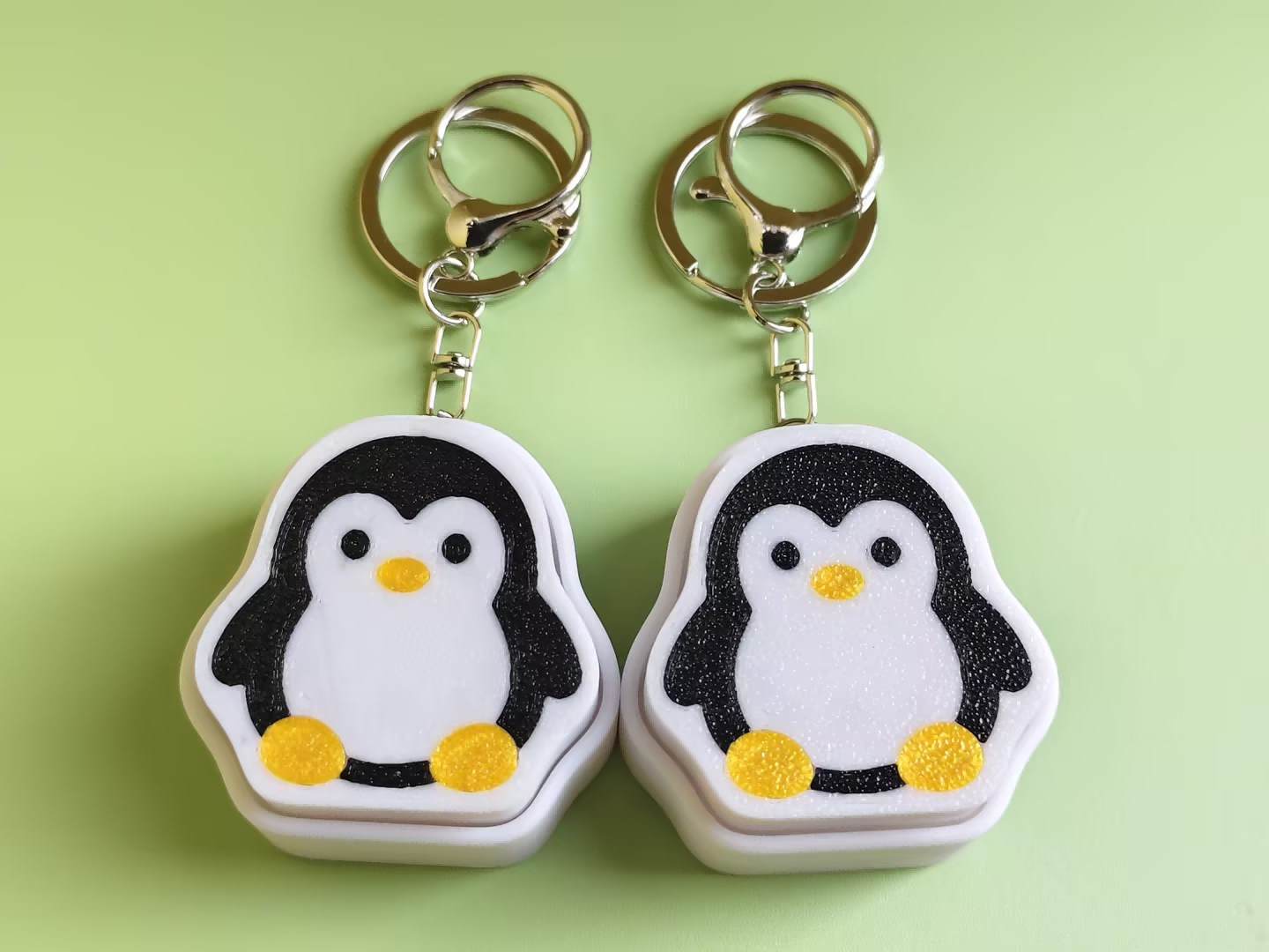 3D printed penguin push-toy keychain
