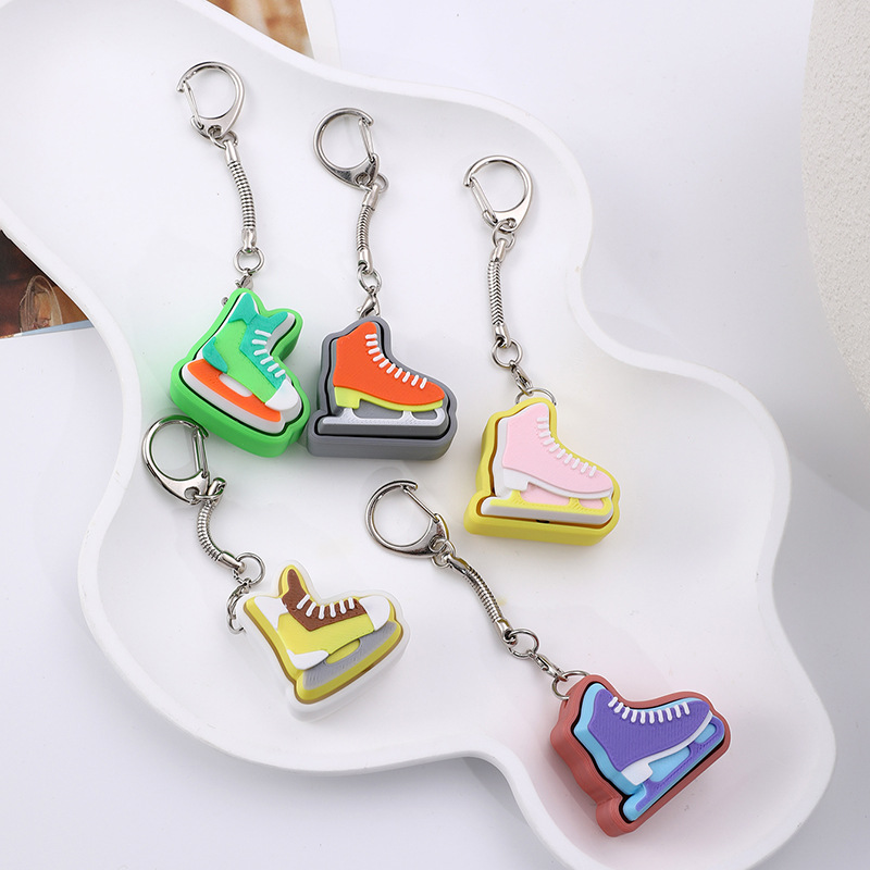 3D-printed ice skate-style stress-relief keychain charm
