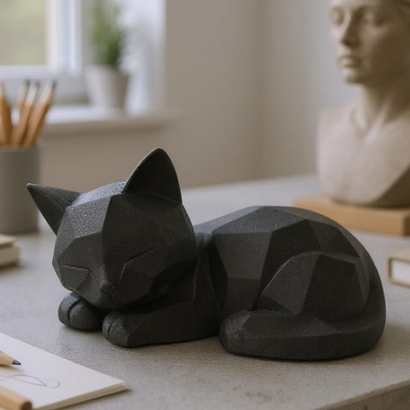 3D-printed sleeping cat figurine