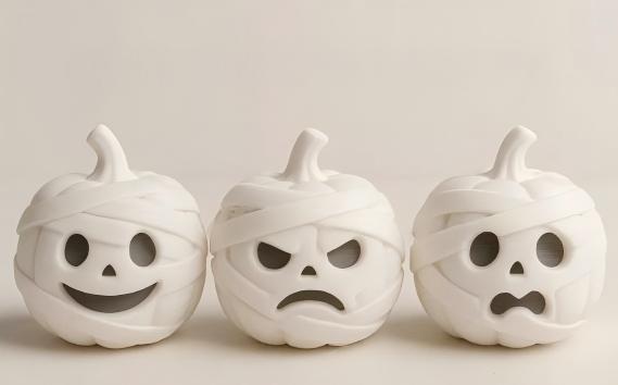 3D-printed mummy, pumpkin, and skull ornaments