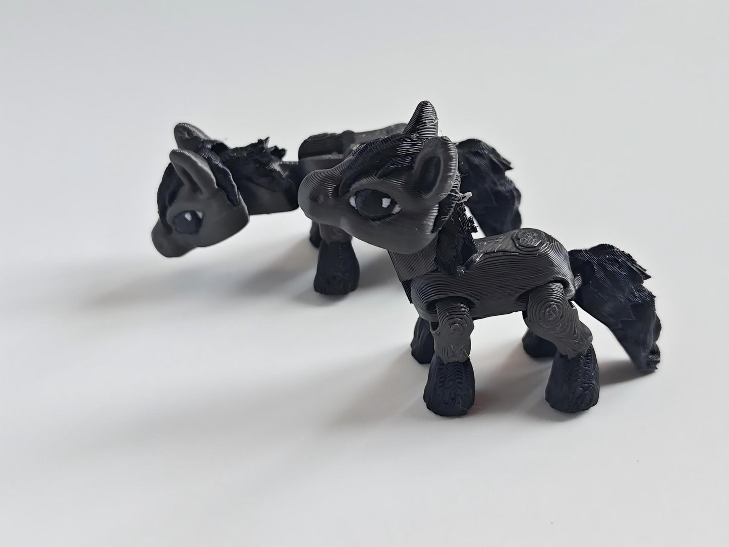 3D-printed black pony figurine