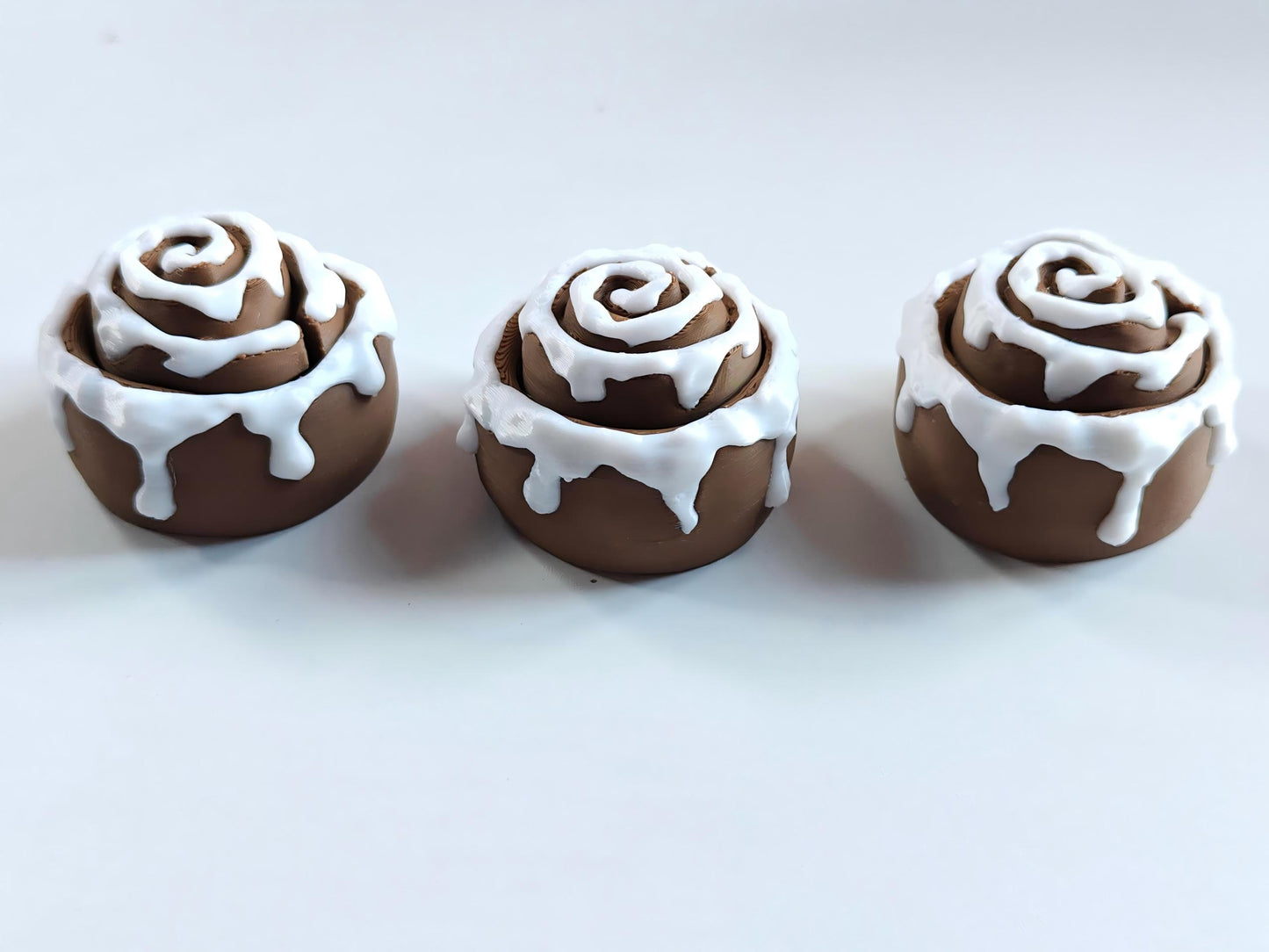 3D-printed frosted cinnamon roll figurine