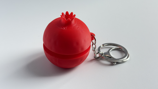 3D-printed pomegranate push-button keychain/charm