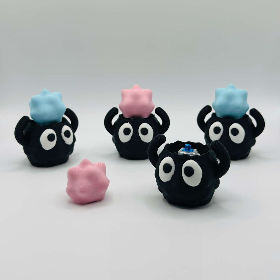 3D-printed cute soot sprite clicker keychain charm