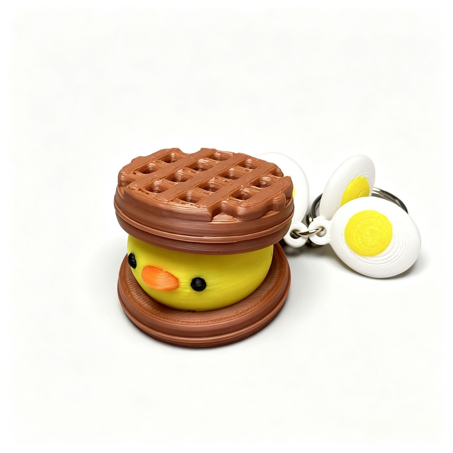 3D-printed cute waffle-chick button clicker keychain charm
