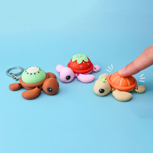 3D-printed cartoon fruit-turtle clicker keychain charm