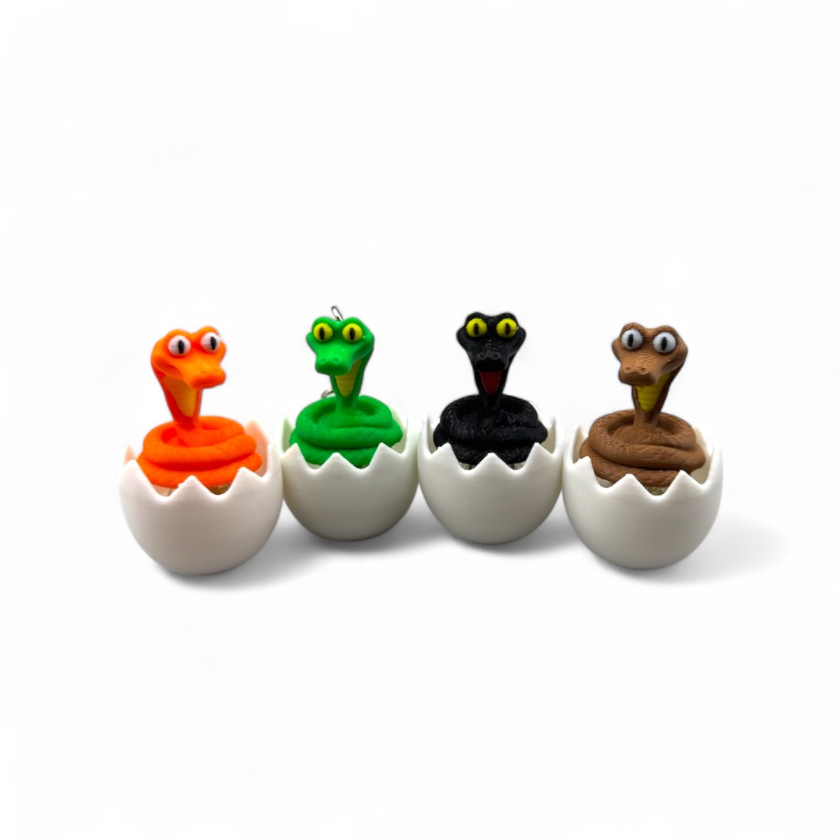 3D-printed hatching snake egg clicker keychain charm