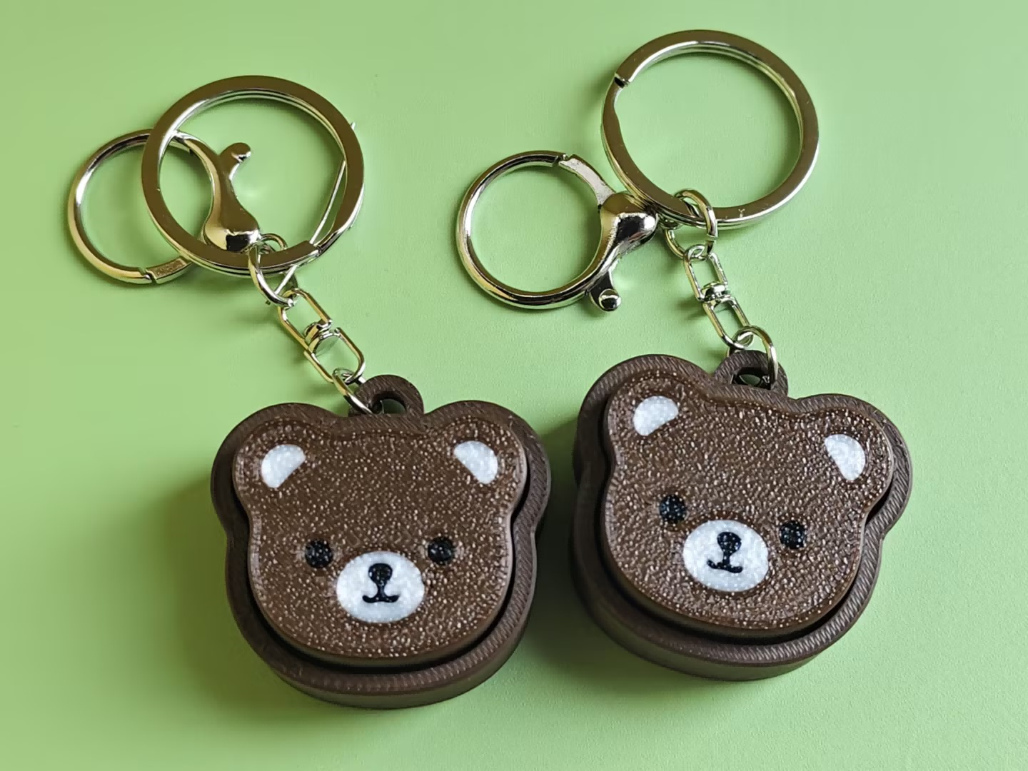 3D printed black bear push-toy keychain