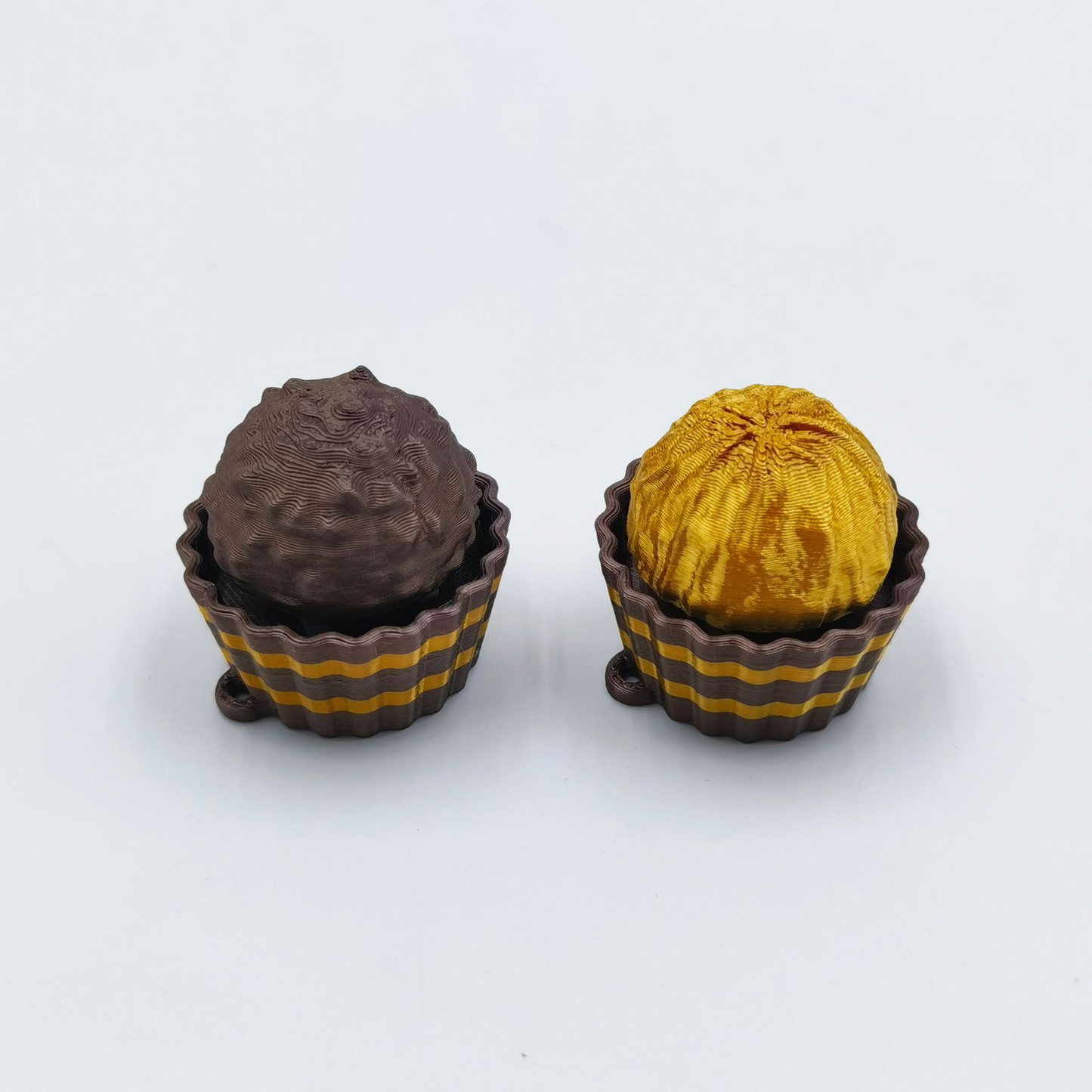 3D-printed stress-relief Ferrero Rocher-style button clicker