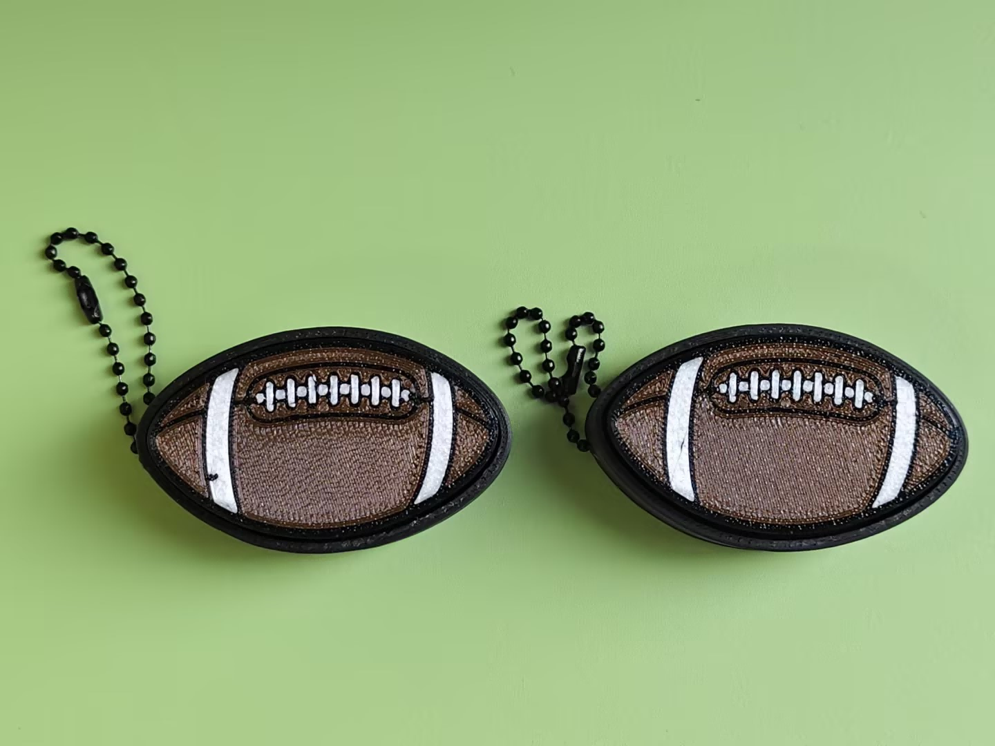 3D printed football push-toy keychain