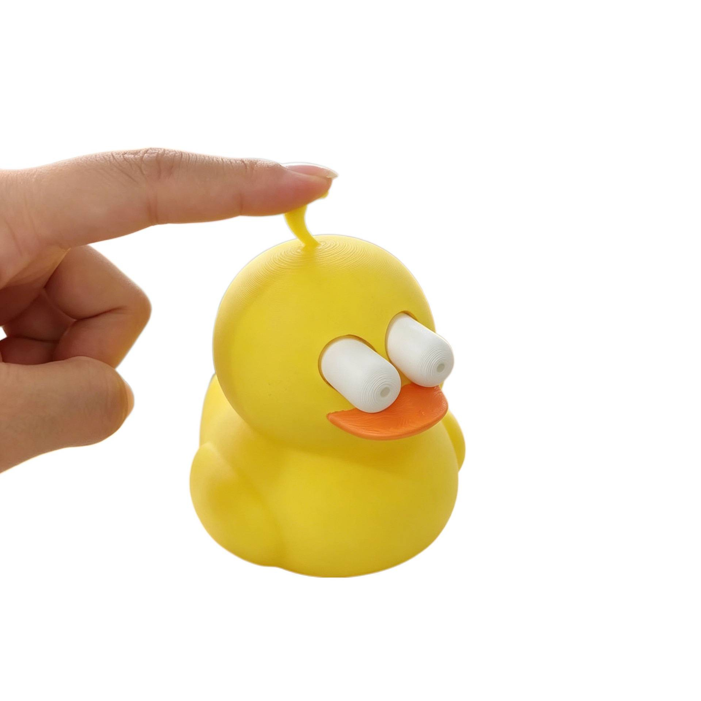 3D-printed little yellow duck with a button (eyes pop out when pressed)