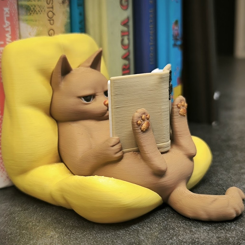 Reading cat figurine