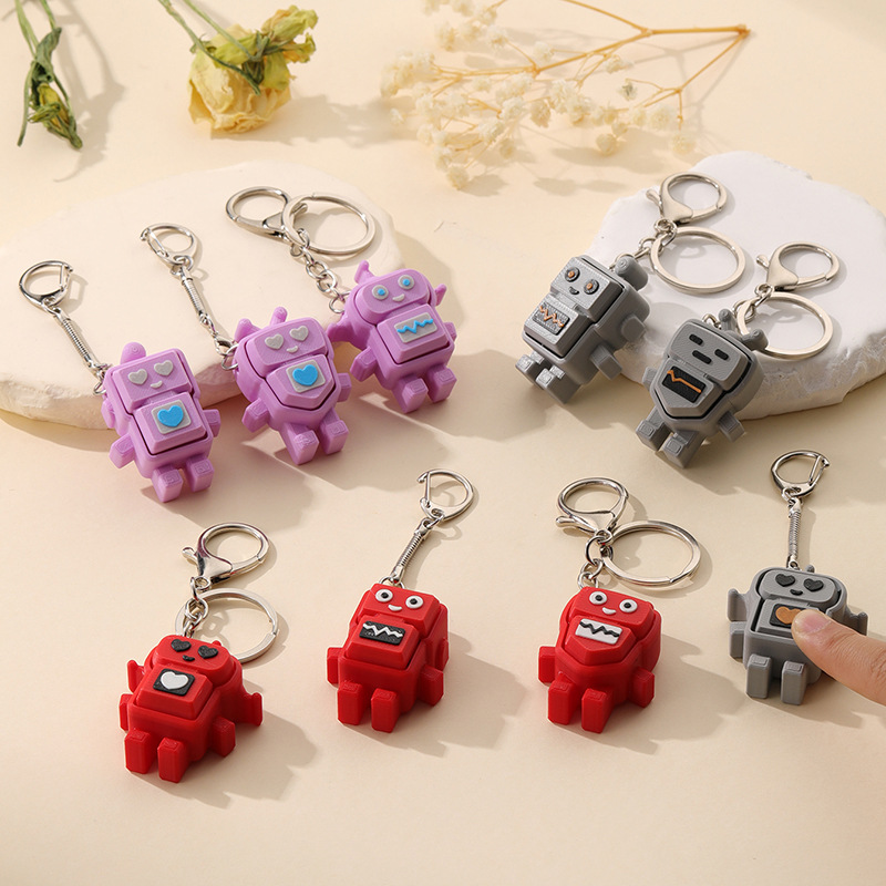 3D-printed robot stress-relief button keychain charm