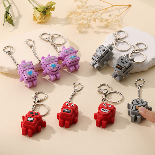 3D-printed robot stress-relief button keychain charm