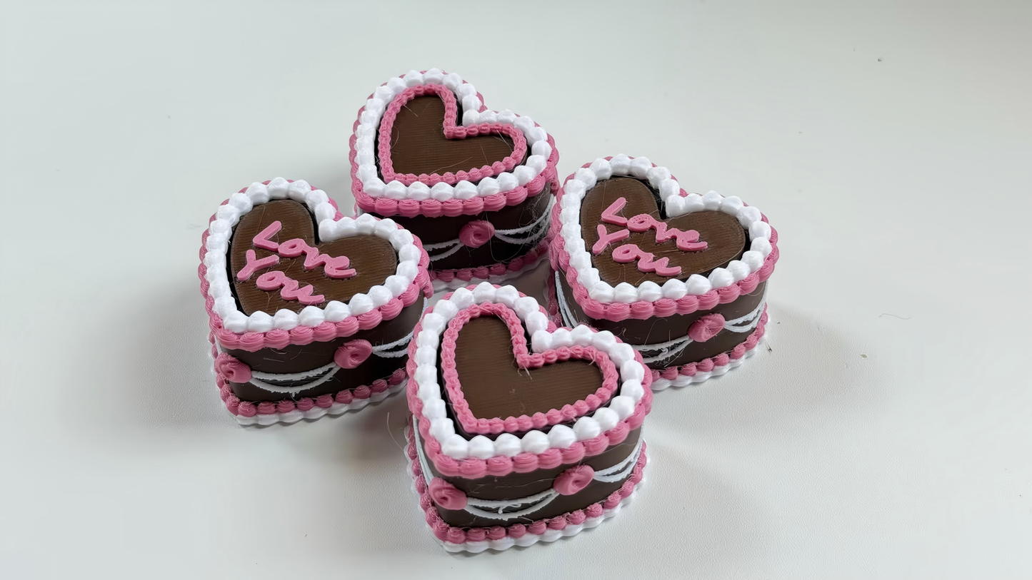 3D-printed heart-shaped cake keycap-style clicker