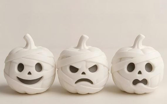3D-printed mummy, pumpkin, and skull ornaments