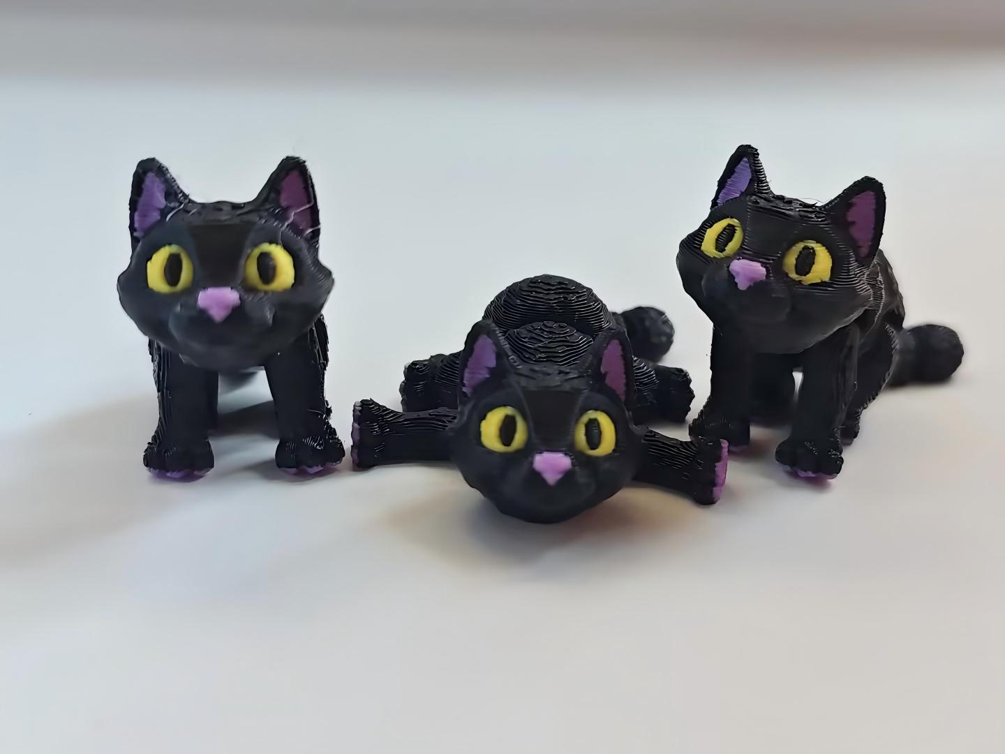 3D printed black and purple kitten figurine