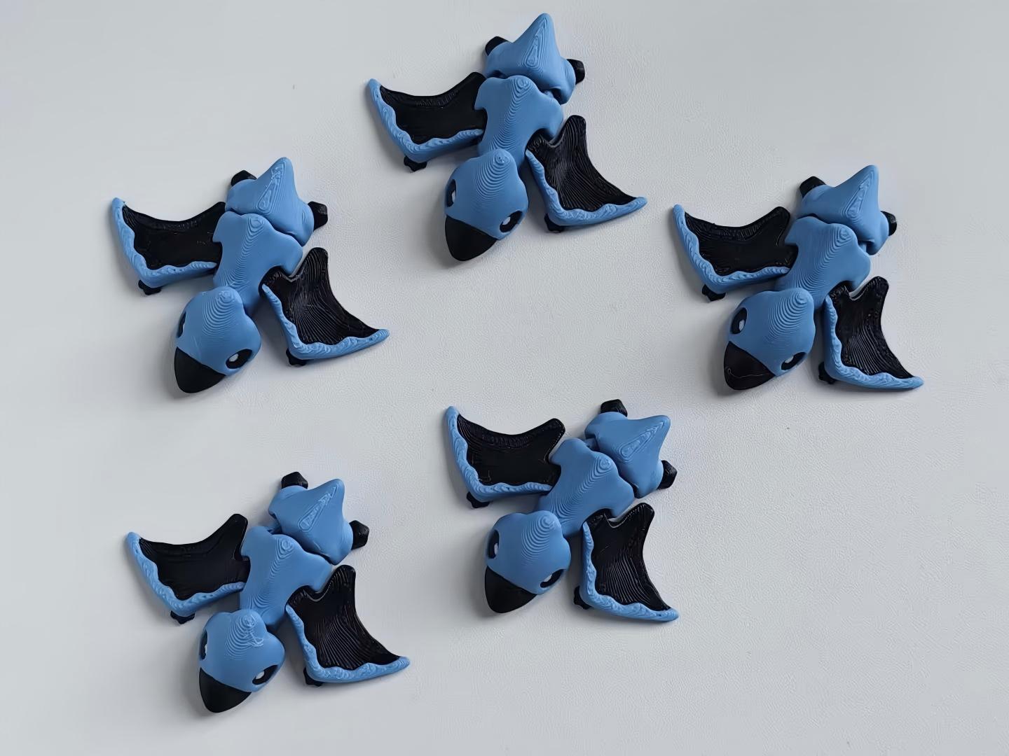 3D-printed articulated small dragon figurine