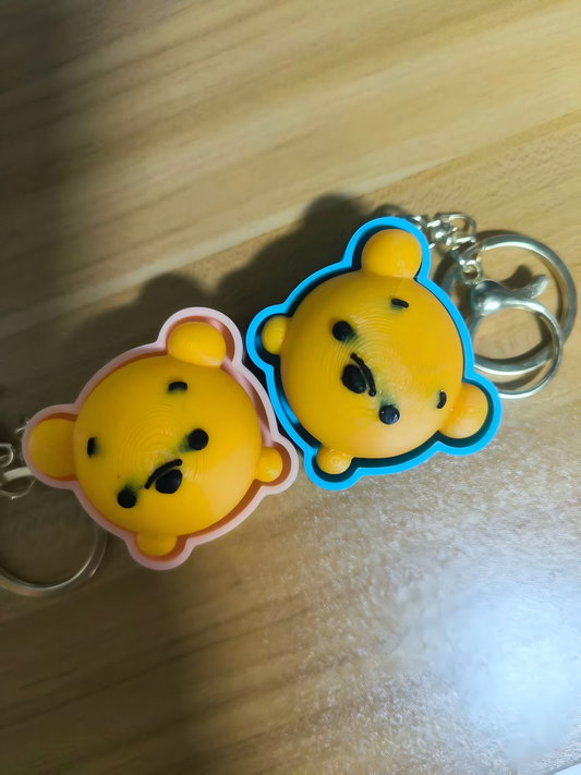 3D-printed Winnie the Pooh face keychain charm