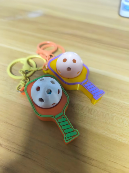 3D-printed tennis racket face keychain charm