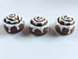 3D-printed frosted cinnamon roll figurine