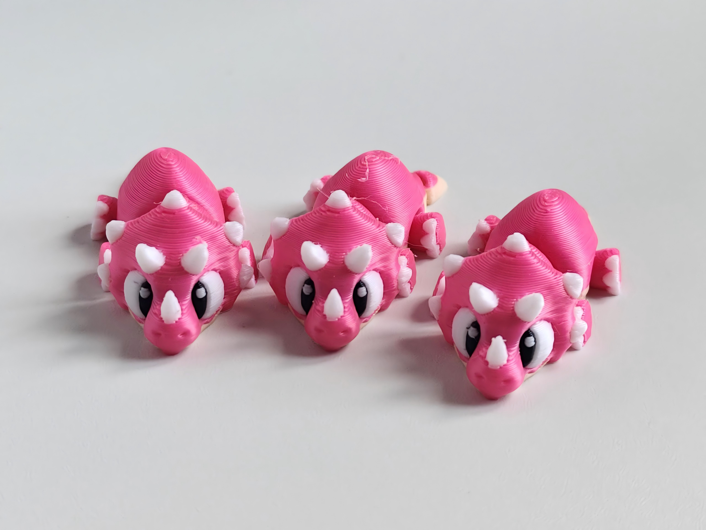 3D printed articulated pink dragon figurine